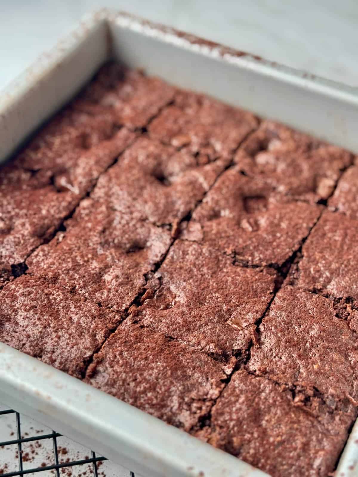 Close up photo of cut brownies in pan