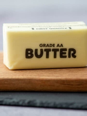 Stick of butter on cutting board