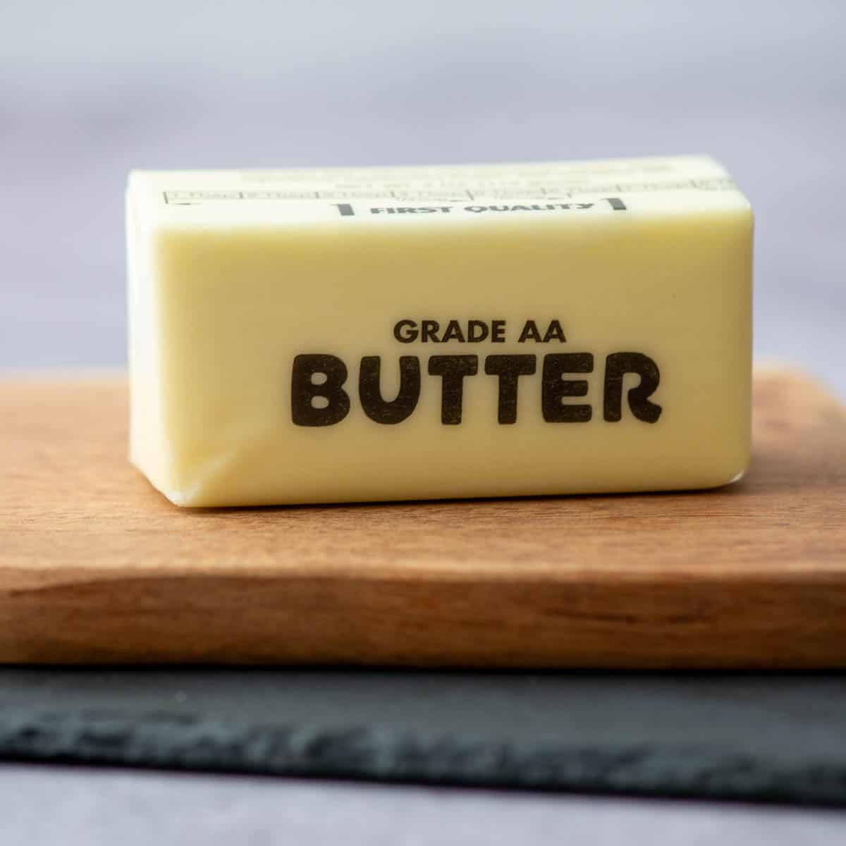 Stick of butter on cutting board