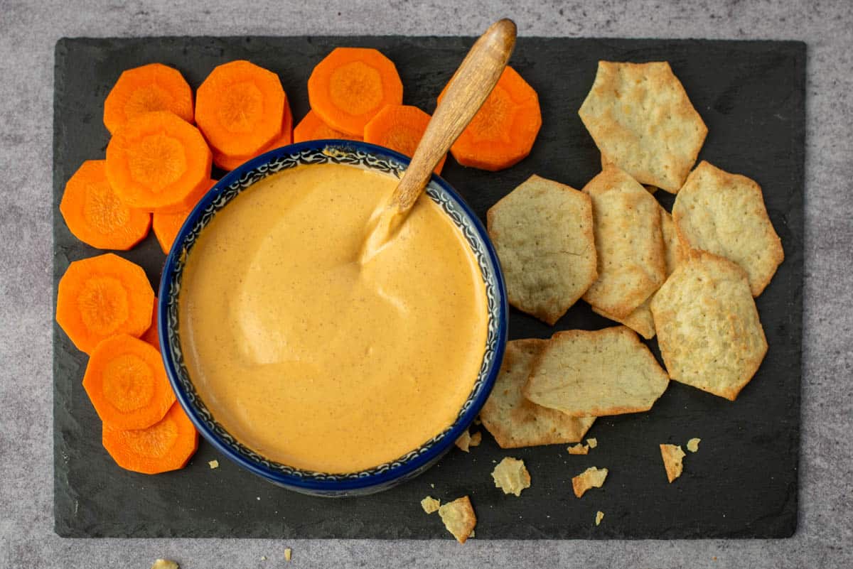 Chipotle almond dip with crackers and carrots