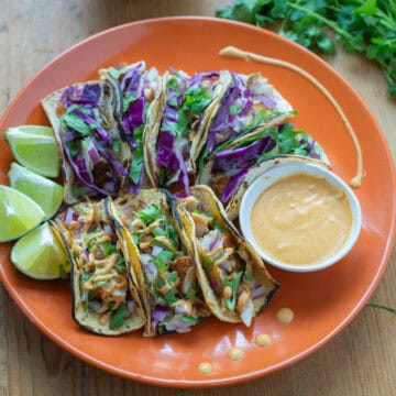 Fish Tacos on Plate with Cilantro in background