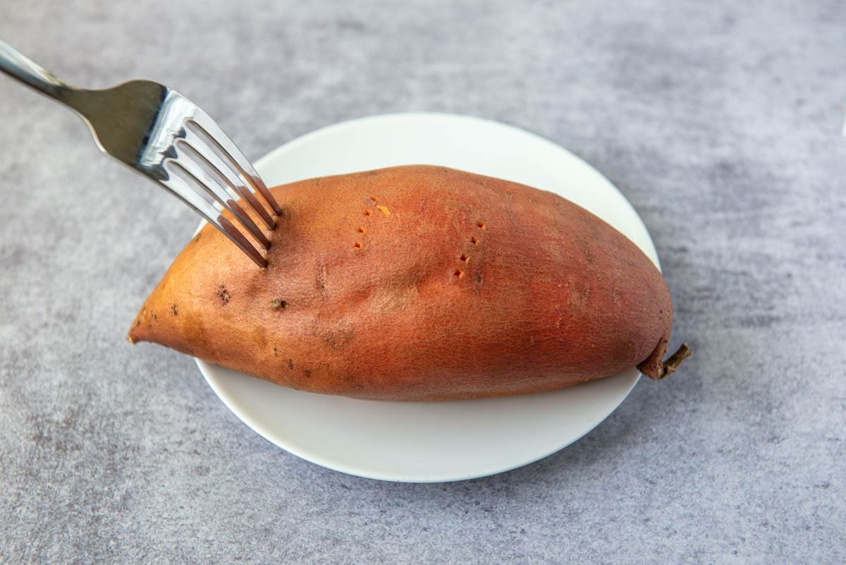 Gluten Free Brownies - Photo of Sweet Potato with fork pricks and fork