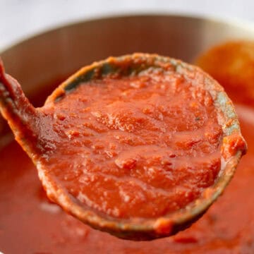 Close up of Marinara Sauce in ladle