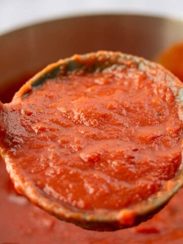 Close up of Marinara Sauce in ladle