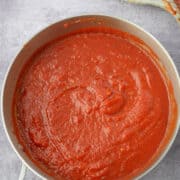 Pan of Marinara Sauce with ladle in background