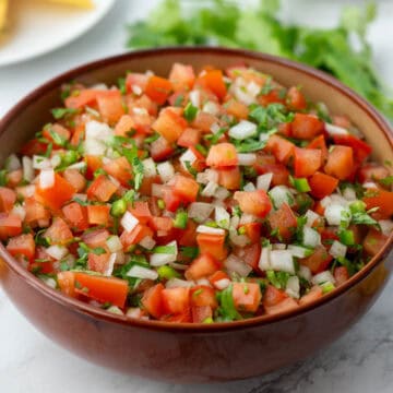 Bowl with Pico de Gallo and cilantro in background