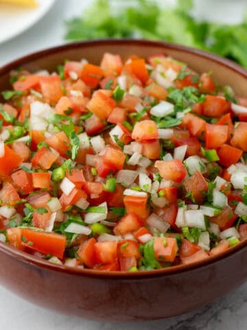 Bowl with Pico de Gallo and cilantro in background