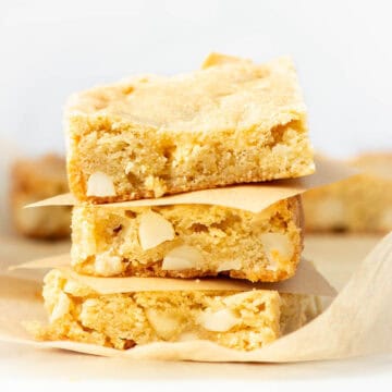 Three stacked Chopped White Chocolate Macadamia Nut Bars