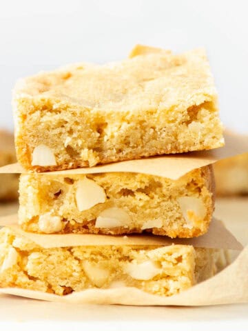 Three stacked Chopped White Chocolate Macadamia Nut Bars