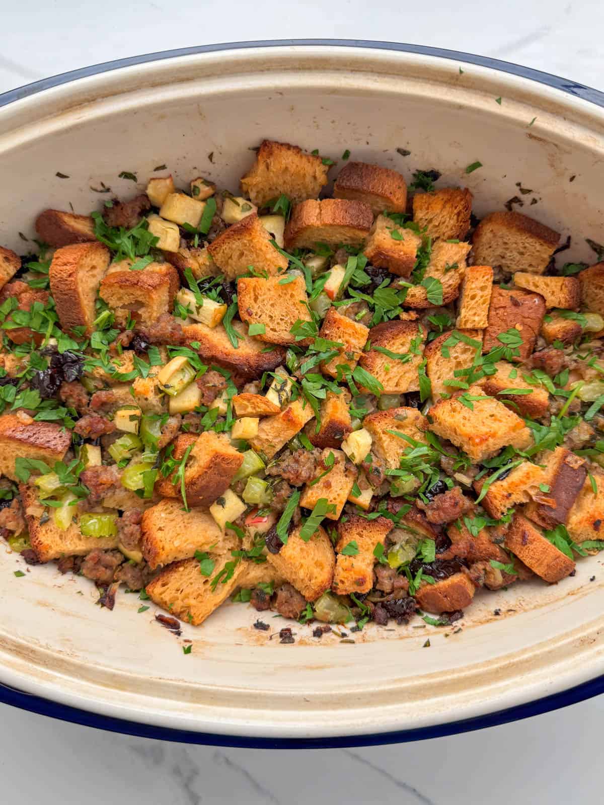 Close up photo of gluten free sausage stuffing in serving bowl