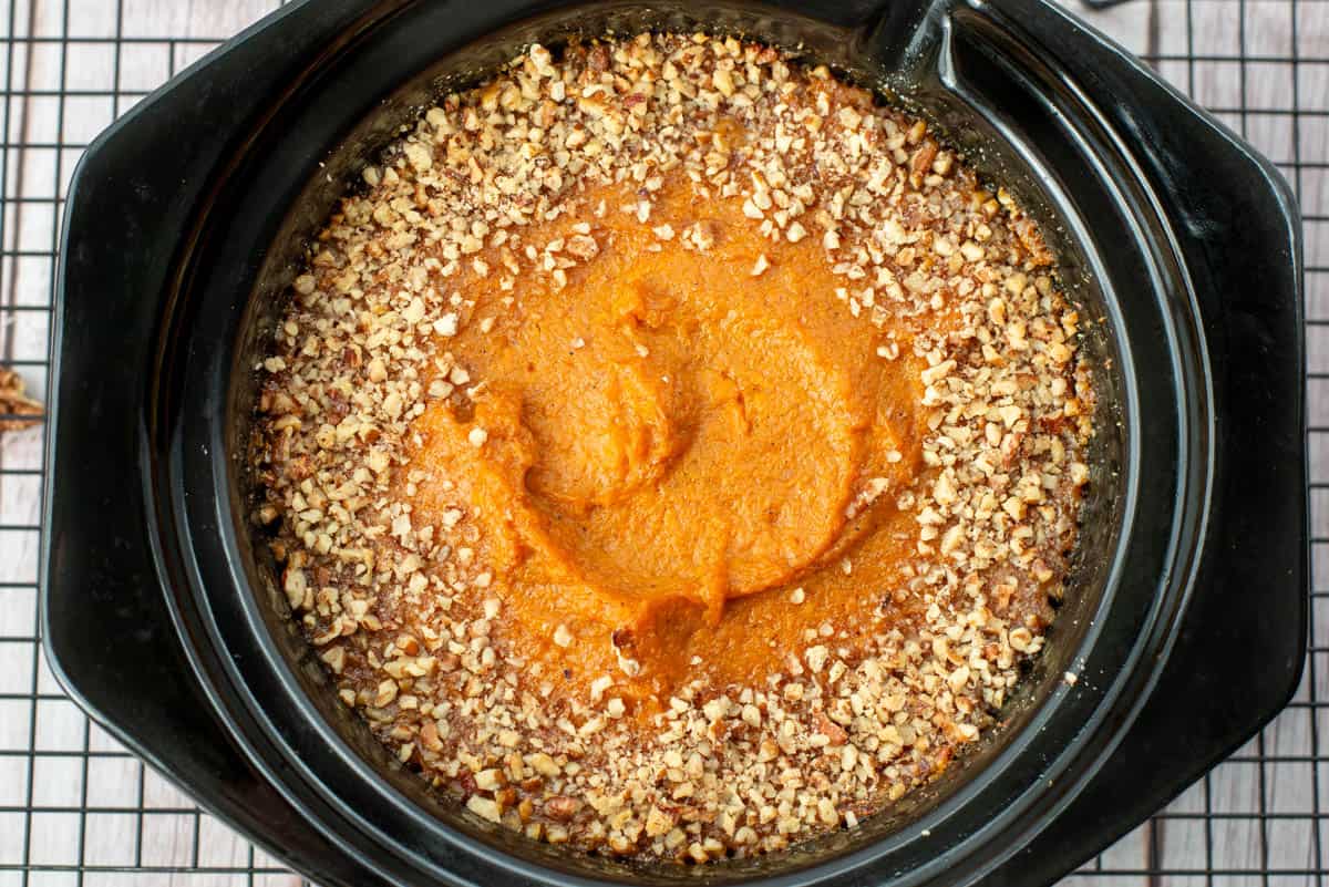 Close up photo of bourbon sweet potatoes in a crockpot insert