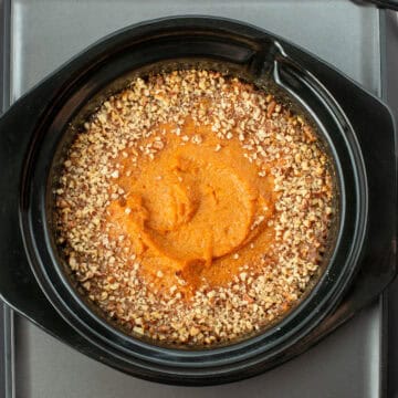 Close up photo of bourbon sweet potatoes in a crockpot insert