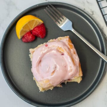 Top view of lemon raspberry sweet roll on a plate