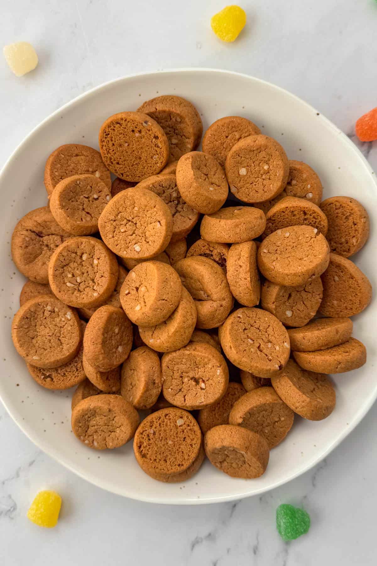 Bowl of Peppernut cookies with spice drop candies in background