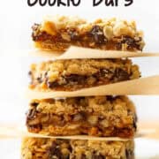 Side view of a stack of four Carmelitas Cookie Bars with a title overlay that says Carmelitas Cookie Bars