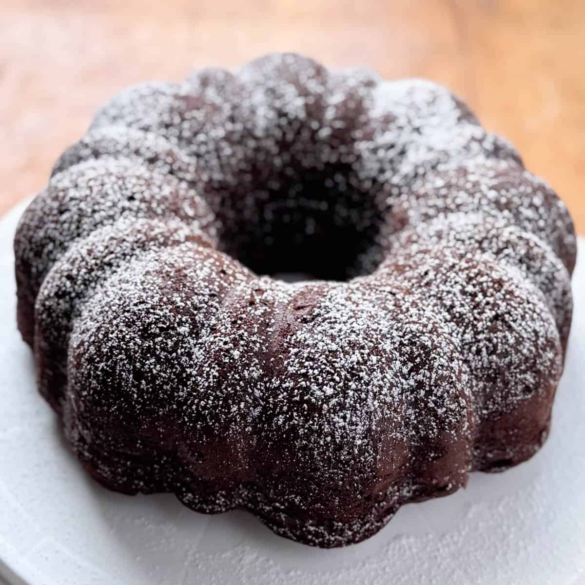 Top view of a chocolate bundt cake topped with powdered sugar