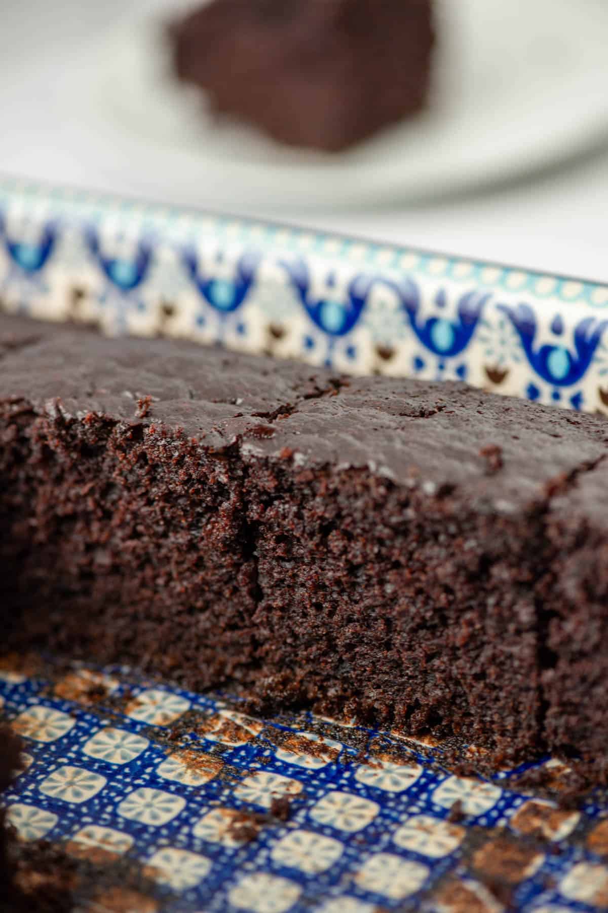 Side view of row of chocolate zucchini cake in the baking pan