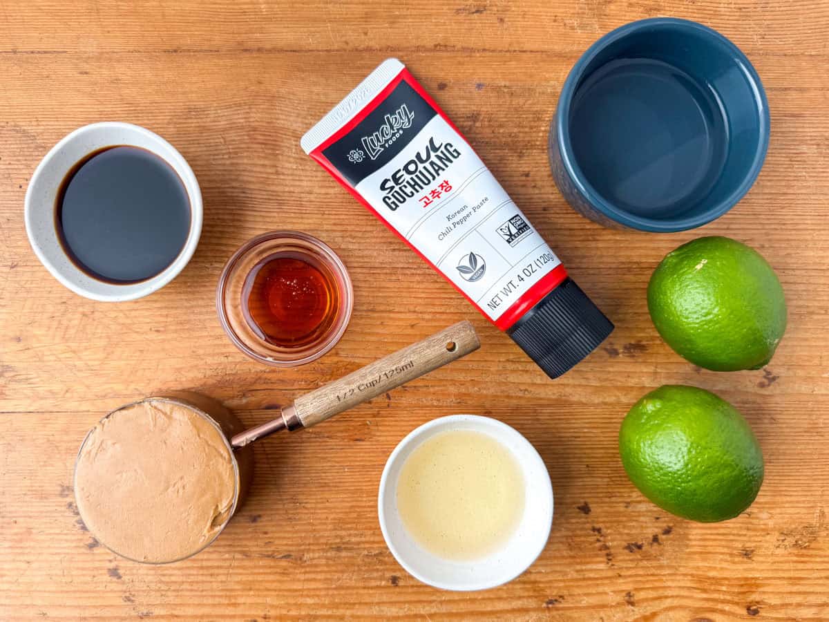 Ingredients needed for peanut dressing: peanut butter, hot water, tamari sauce, rice vinegar, honey, Gochujang and limes