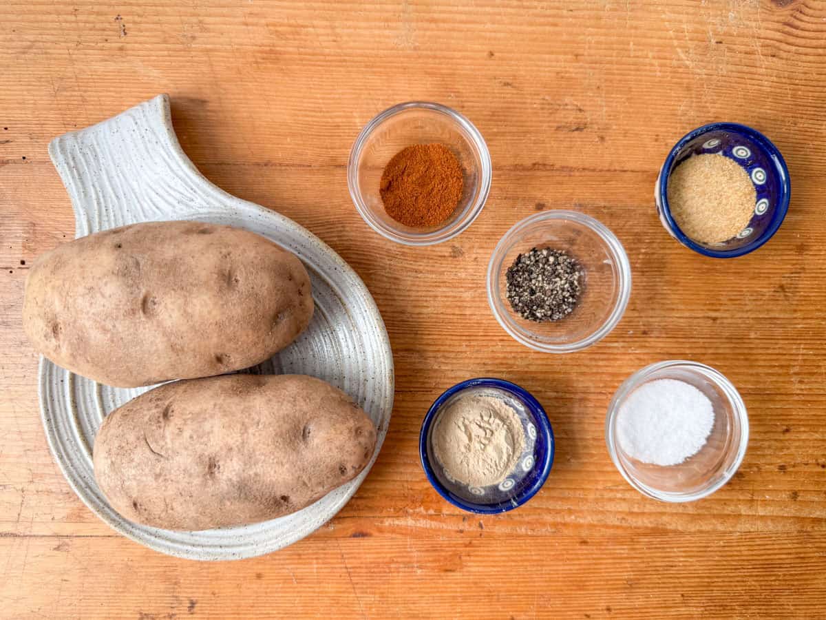 Ingredients needed to make hash browns: two medium potatoes, salt, pepper, onion powder, garlic powder and paprika