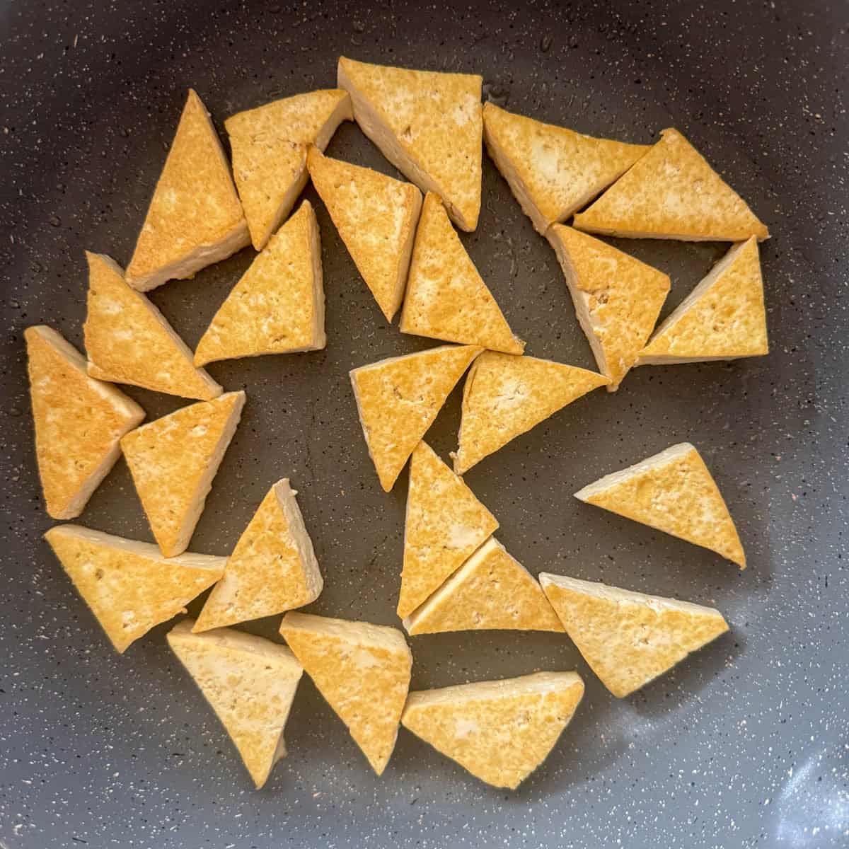 Overhead photo of pan-seared tofu in the pan