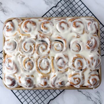 Overhead view of a full pan of 24 mini cinnamon rolls