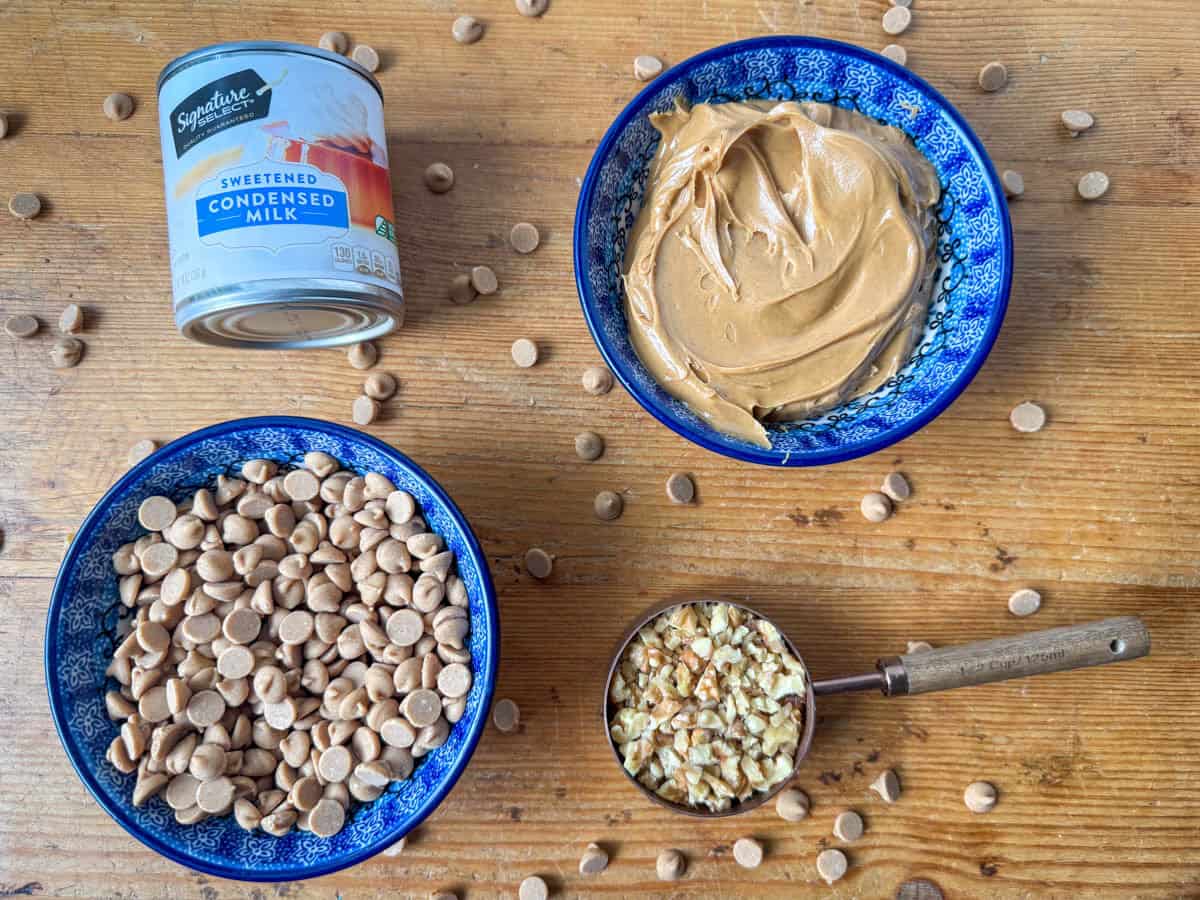 Ingredients needed for peanut butter fudge: peanut butter chips, peanut butter, sweetened condensed milk and chopped walnuts