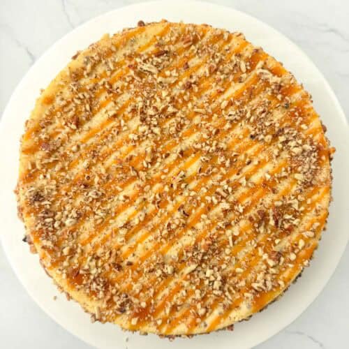 Top view of a decorated salted caramel pecan cheesecake