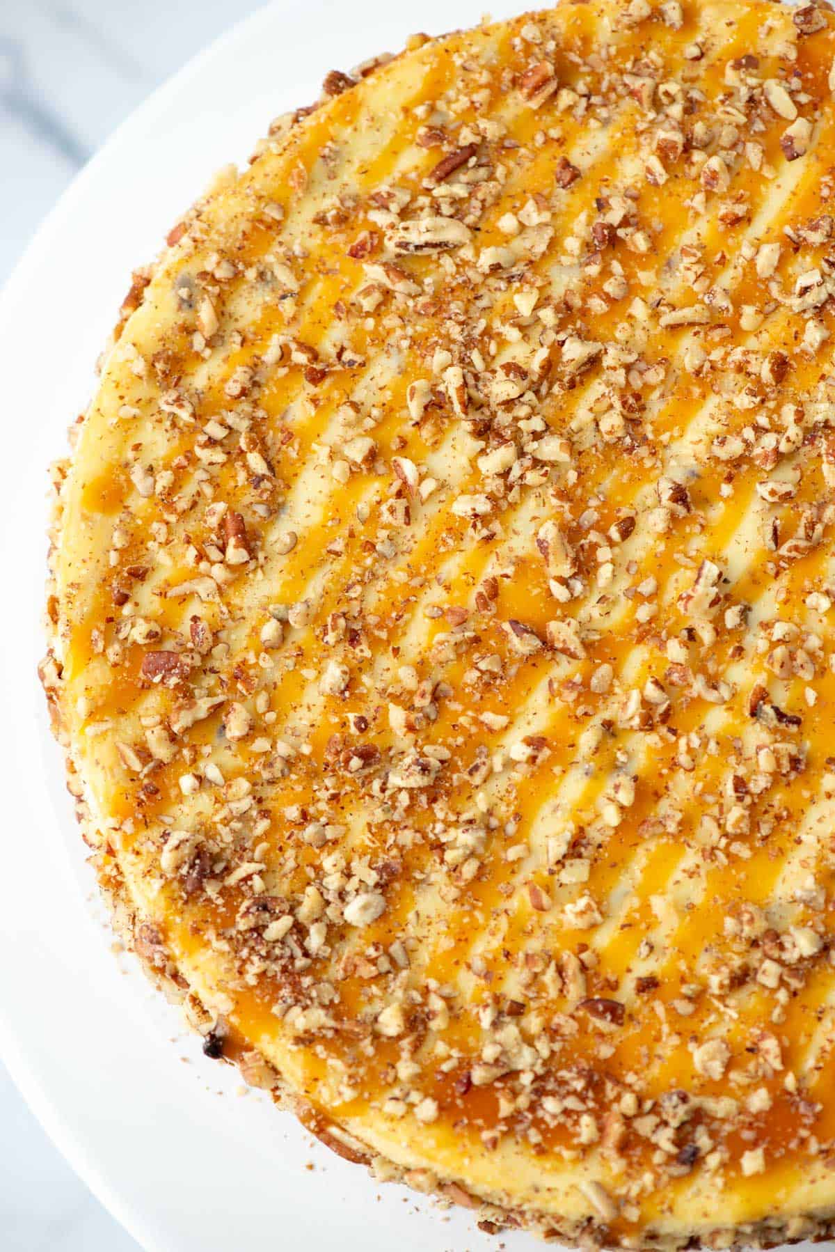 Top view of a partial salted caramel pecan cheesecake