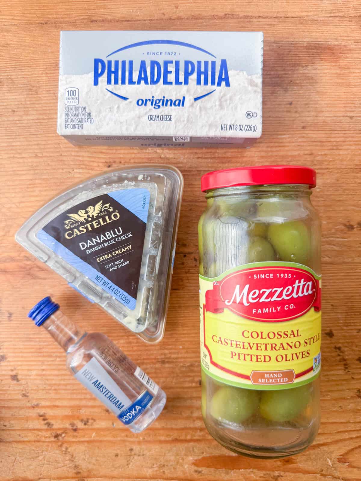 Ingredients needed to. make dirty martini dip: cream cheese, Castelvetrano olives, blue cheese and vodka