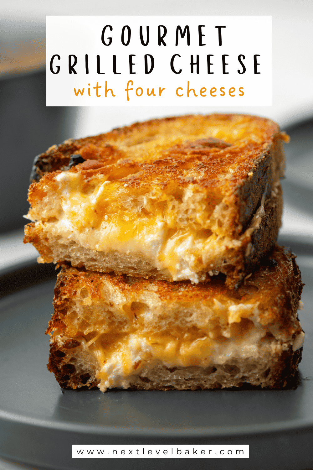 Close up view of a cut grilled cheese sandwich with a title overlay saying Gourmet Grilled Cheese with Four Cheeses at the top and www.nextlevelbaker.com at the bottom