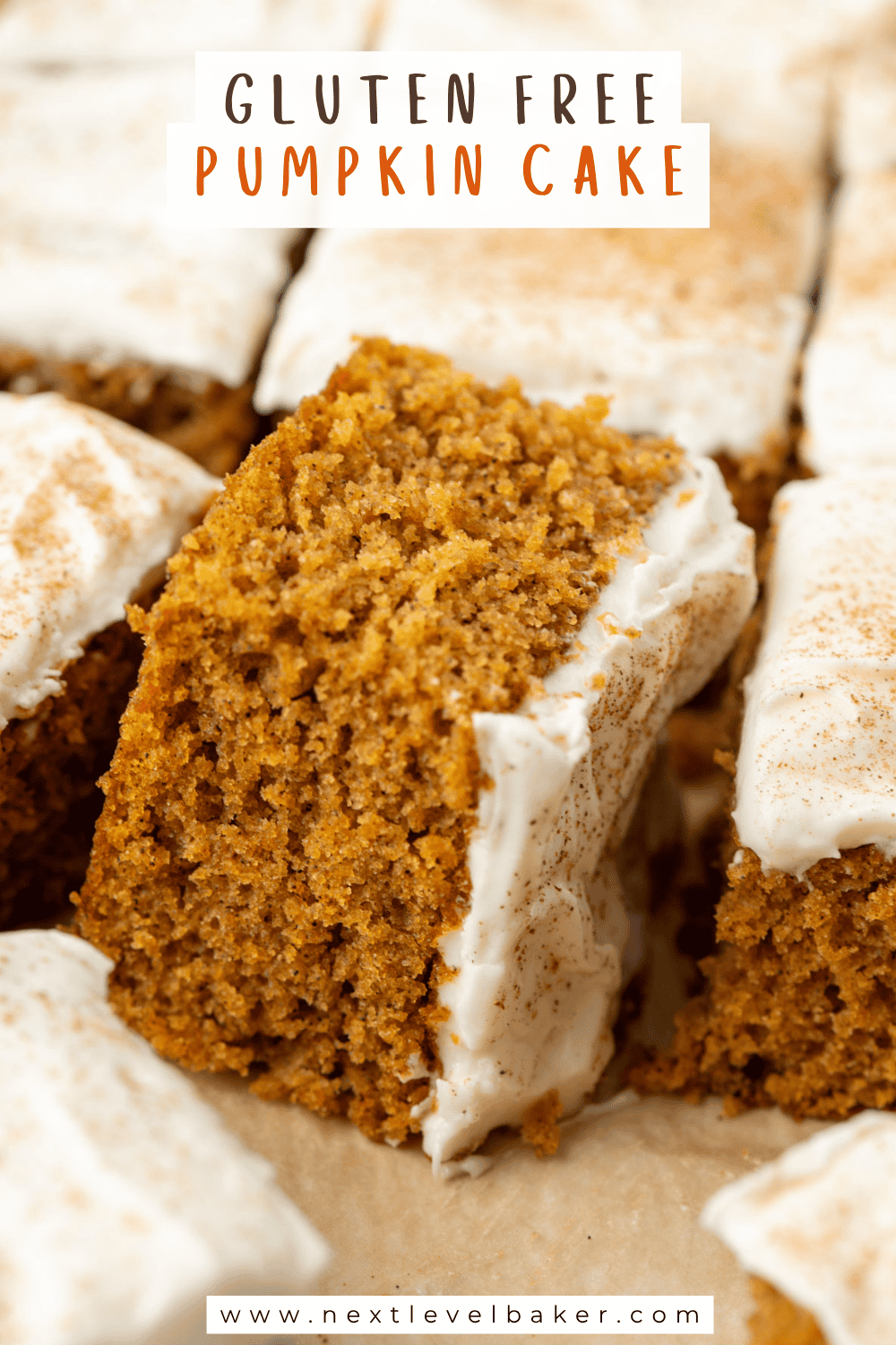 Overhead view of slices of gluten free pumpkin bar cake with cream cheese frosting. The middle slice is turned on its side so that you can see the density and crumb of the cake with text overlaying the photo that says Gluten Free Pumpkin Cake at the top and www.nextlevelbaker.com at the bottom