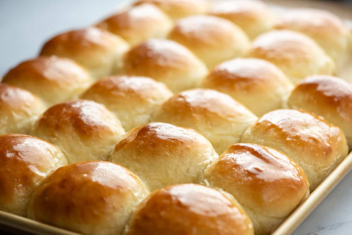 Light and fluffy homemade dinner rolls still in the sheet pan