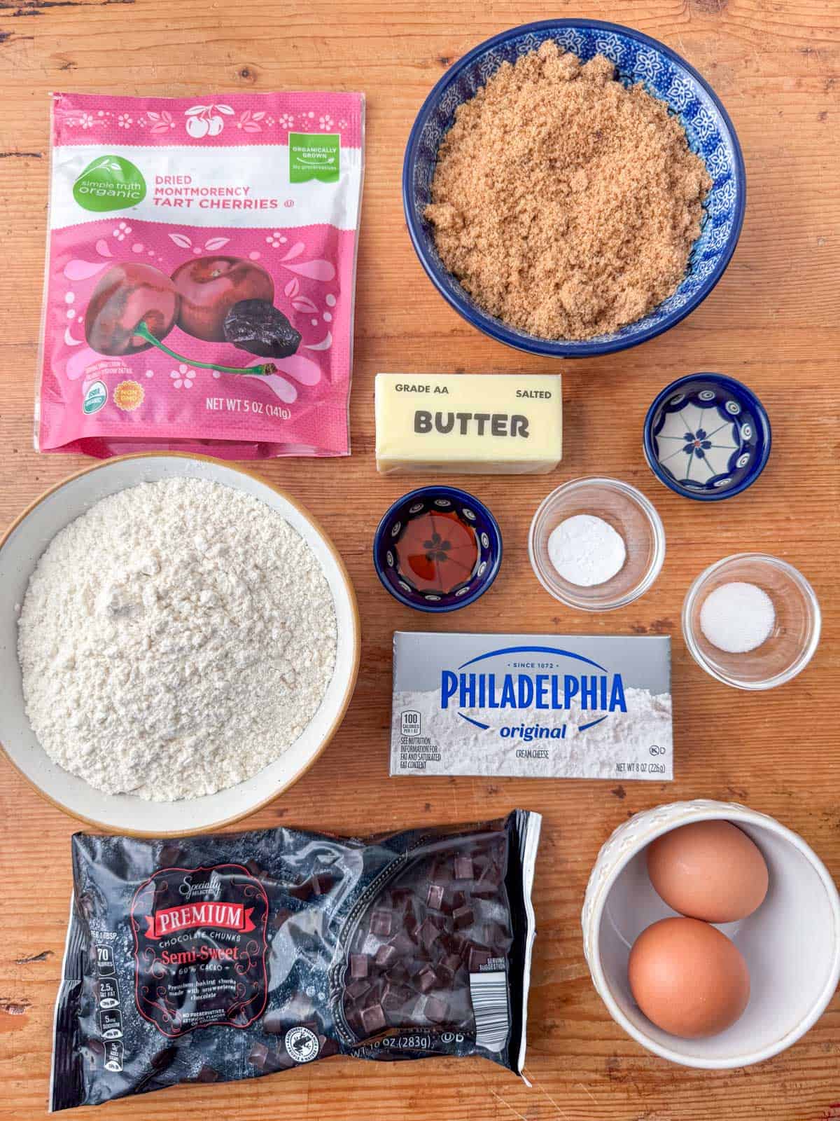 ngredients needed to make cherry chocolate chunk cookies: dried cherries, chocolate chip chunks, all purpose flour, baking soda, salt, butter, cream cheese, brown sugar, eggs, almond extract and vanilla extract