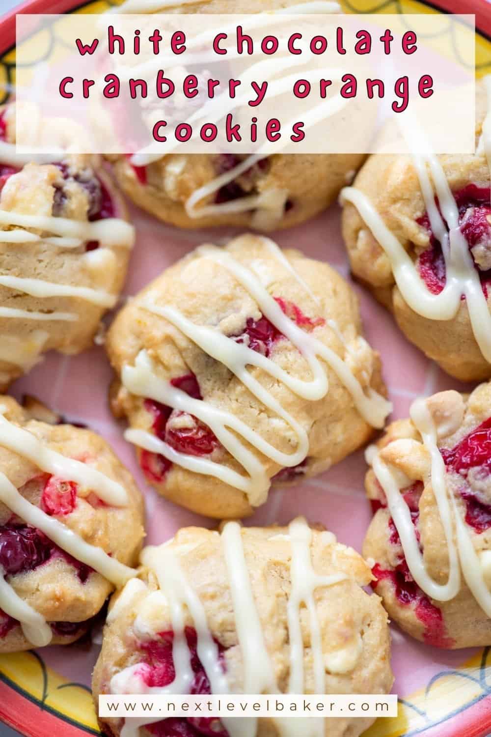 Close up overhead photo of 8 white chocolate cranberry orange cookies on a plate with a title overlay and another overlay that says www.nextlevelbaker.com