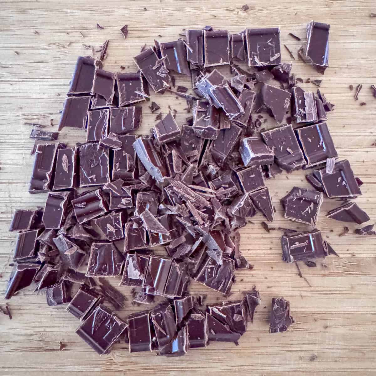 Photo illustrating rough chopped chocolate for orange chocolate ganache