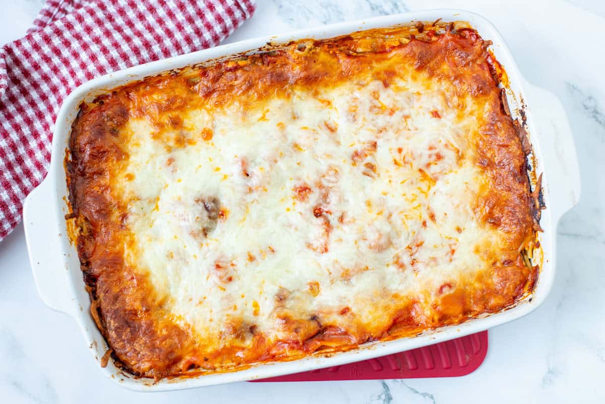 Overhead view of a baked 9x13 pan of veggie lasagna