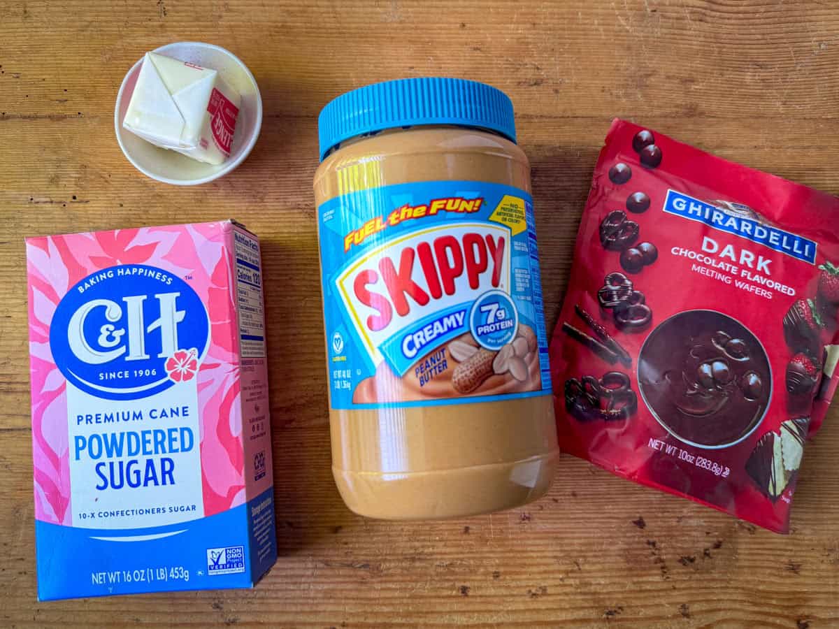 Ingredients needed to make chocolate peanut butter truffles: peanut butter, salt butter, powdered sugar and chocolate melting wafers