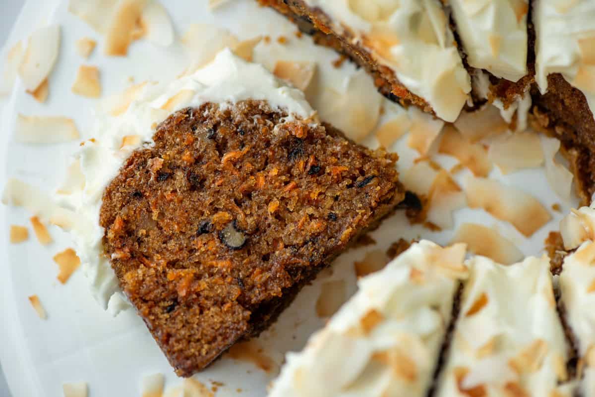 Overhead view of a slice of carrot bundt cake on its side among other slice of the cake that are still upright