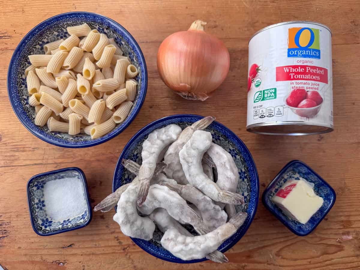 Ingredients needed for shrimp rigatoni with tomato butter sauce: shrimp, rigatoni, canned whole tomatoes, onion, salted butter and salt.