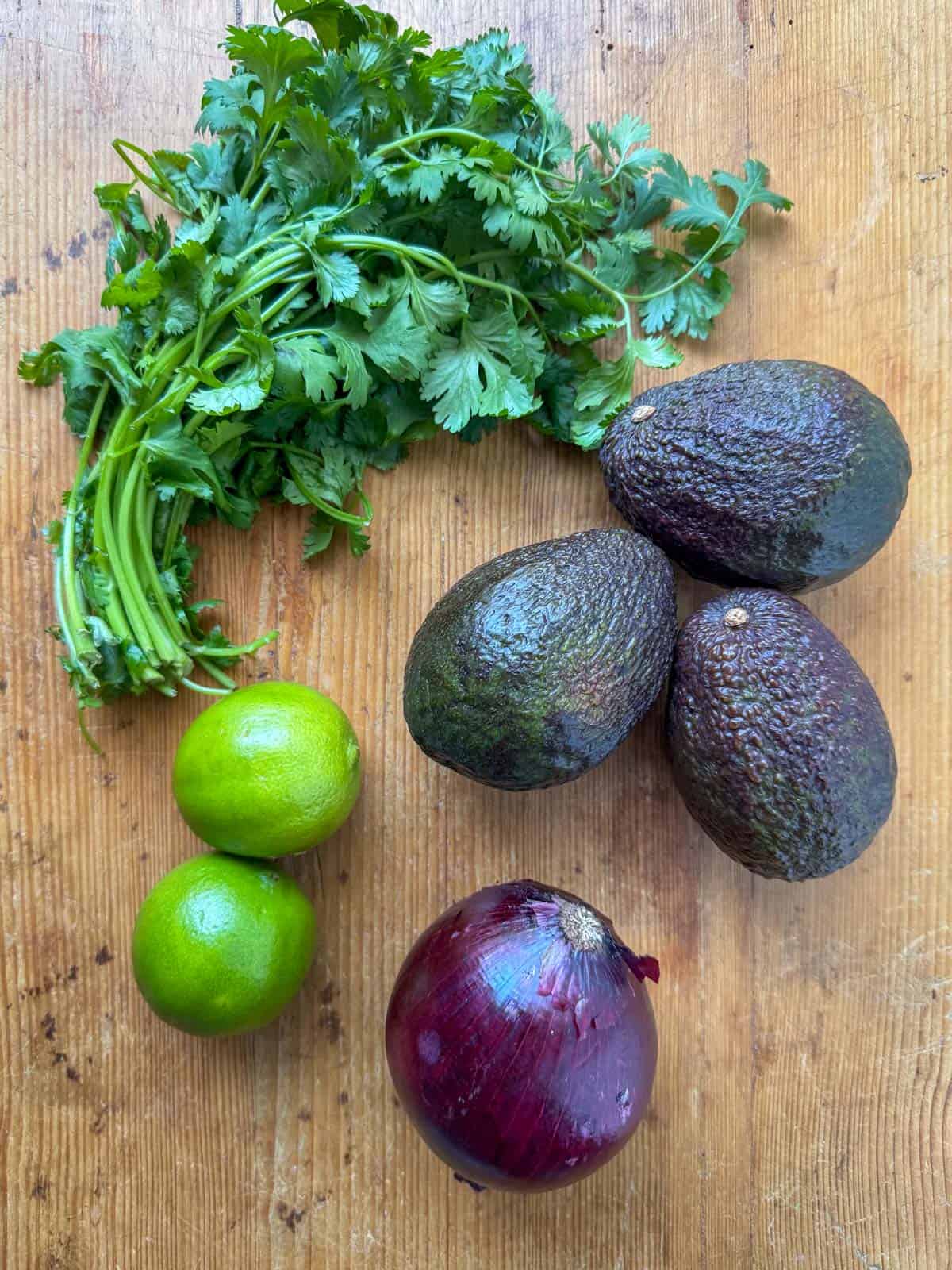 Main ingredients for guacamole: avocado, red onion, lime and cilantro