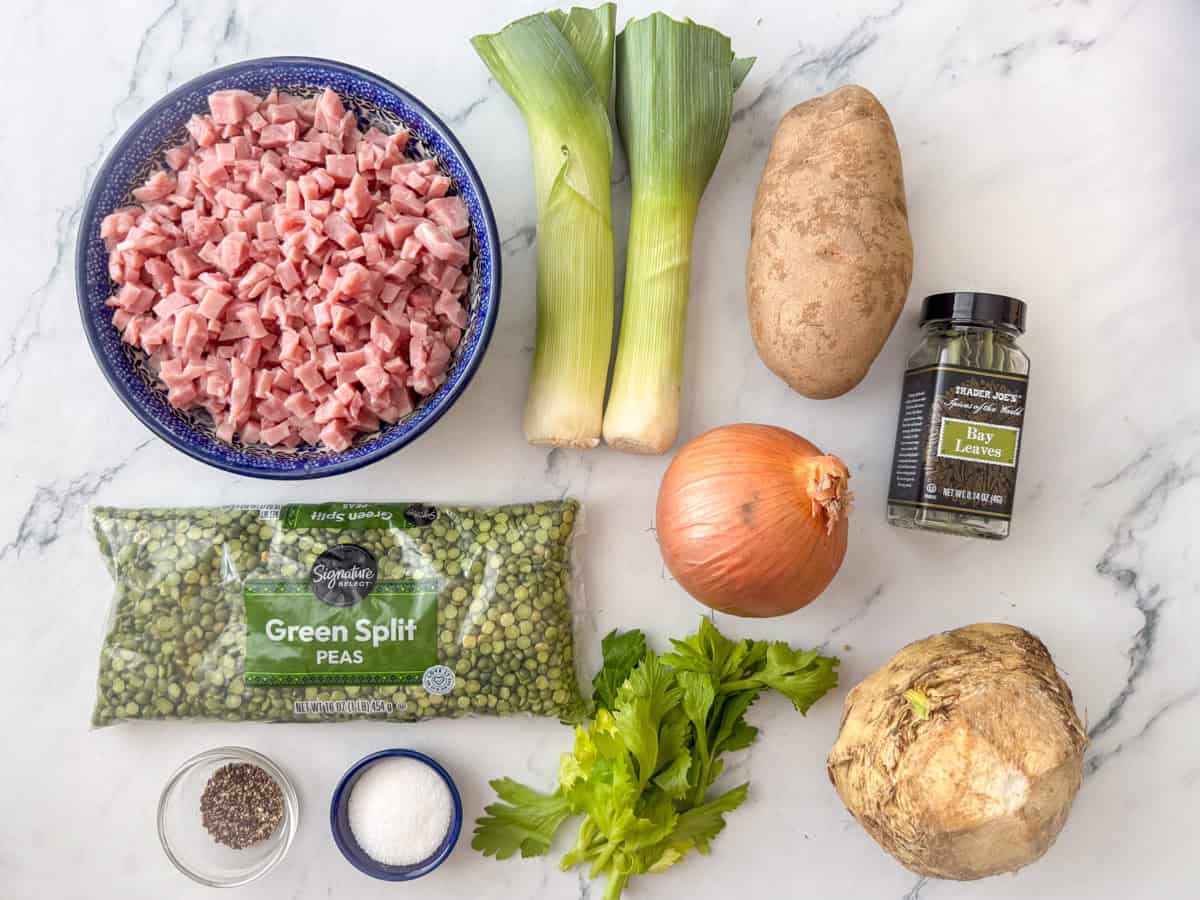 Ingredients needed for split pa soup: split peas, ham, potato, onion, leeks, celery root, celery leaves (optional), bay leaves, salt and pepper.