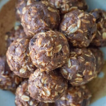 Overhead image of a stacked chocolate protein powder balls on a plate