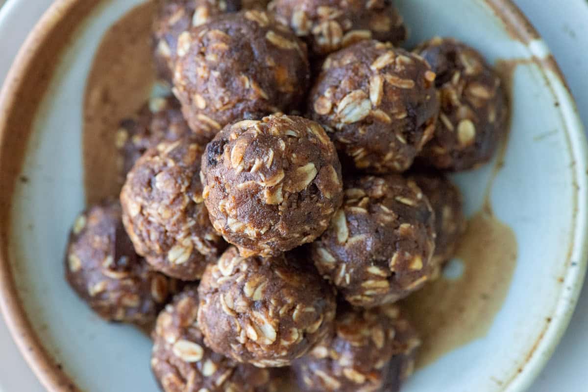Overhead image of a stacked chocolate protein powder balls on a plate