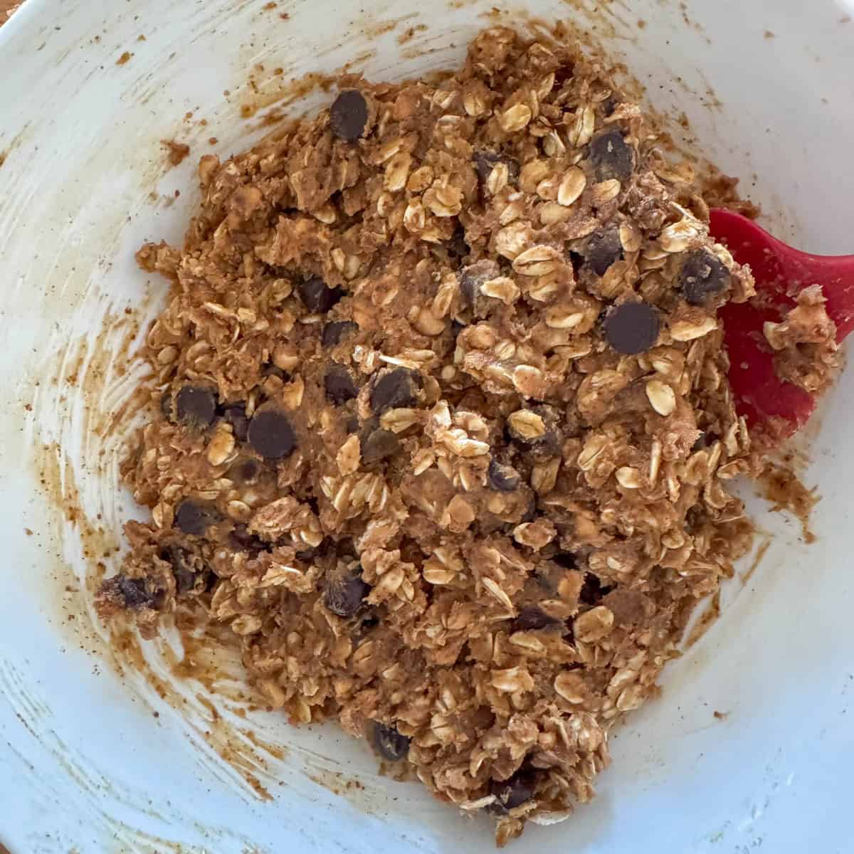 Step 3 of making no bake oatmeal peanut butter balls: stir all ingredients until evenly combined
