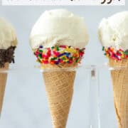 Side view of 1 whole and 2 partial homemade vanilla bean ice cream cones in sugar cones in an ice cream holder with a title overlay that says Easy Vanilla Bean Ice Cream (No Eggs)