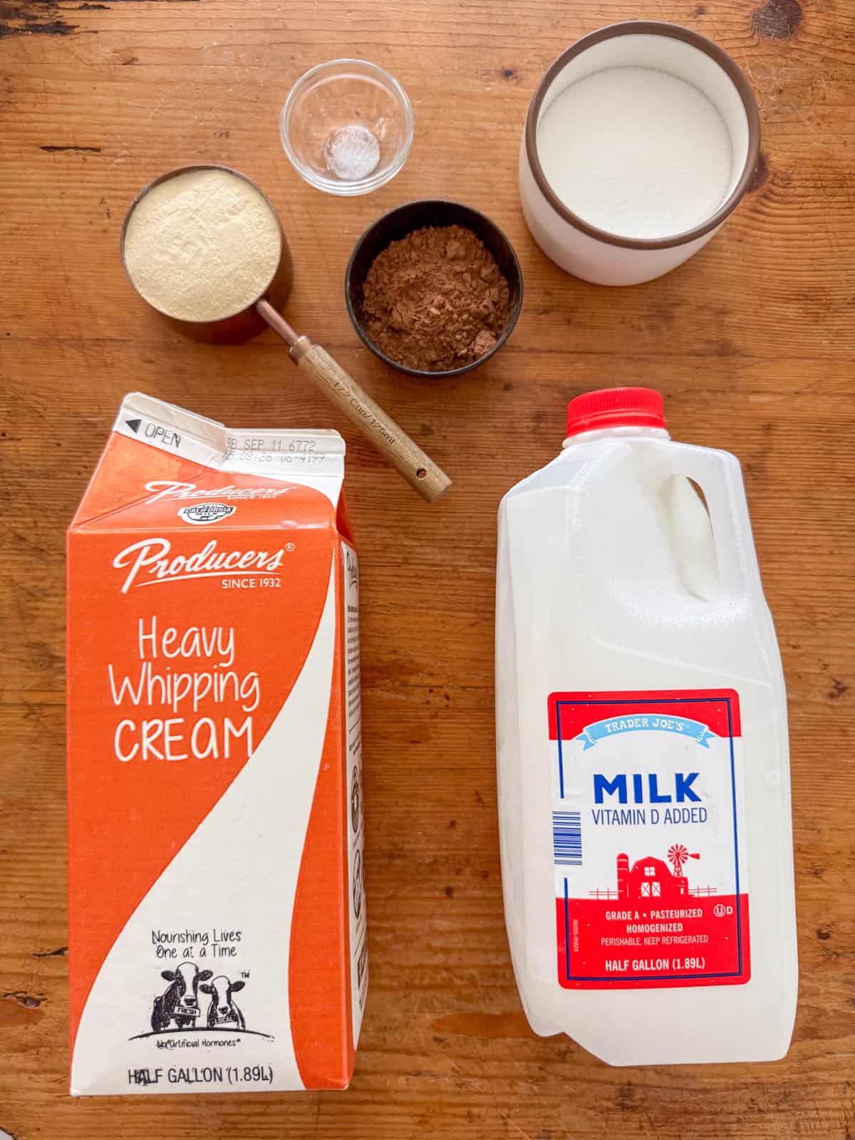 Ingredients needed to make chocolate malt ice cream: heavy whipping cream, whole milk, white sugar, malted milk powder, cocoa powder and salt.
