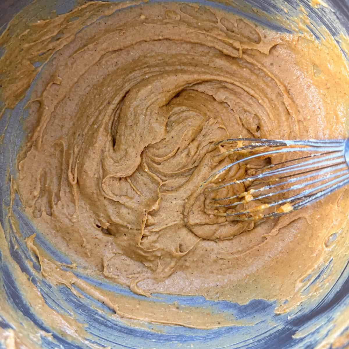 Step 3 of making pumpkin coffee cake: add the yellow cake to the mixing bowl and mix until combined