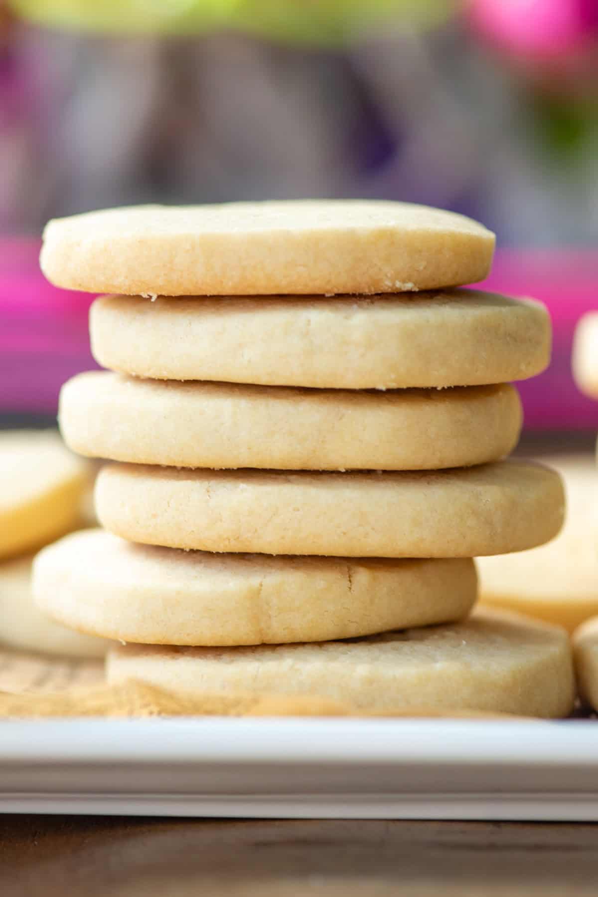 Side view of a stack of 6 dairy free shortbread cookies