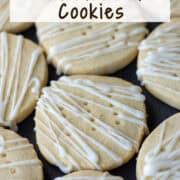 Overhead view of a single layer of dairy free shortbread cookies with a frosting drizzle on a platter. It also has a title overlay that says Dairy Free Shortbread Cookies